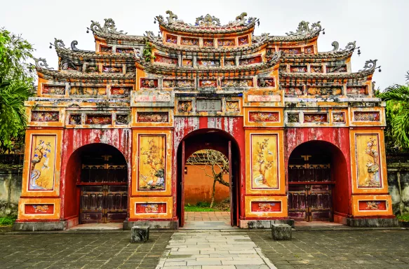 Large, colorful temple entrance to the temple Thế Miếu, Hue, Vietnam