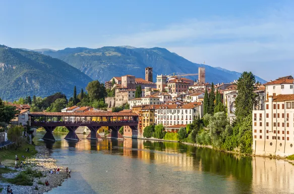 Old bridge in Bassano del grappa in Italy with the mountain peaks in the distance