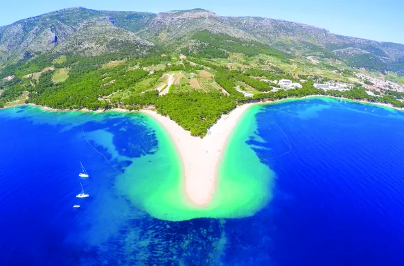 Beautiful large Golden Horn beach along the coastline of Croatia with blue waters