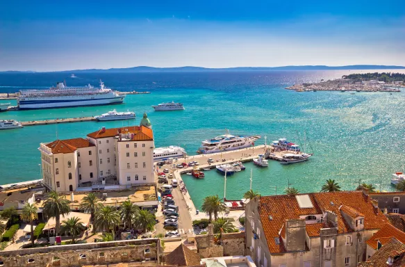 Aerial view of Split's harbour and buildings with distant cruise ships in Dalmatia, Croatia