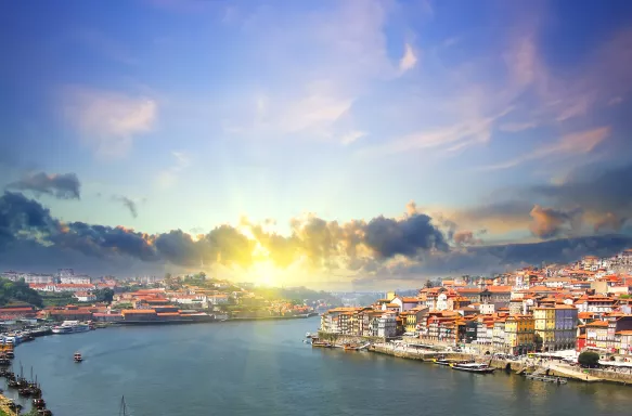 Colourful view of Douro riverside and the Dom Luiz bridge, Portugal.