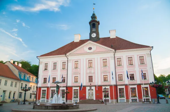 Front view of Tartu City Town Hall and fountain, located in Town Hall Square