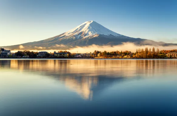 Mount Fuji and its reflection in lake on a bright day in Japan