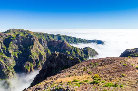 Landscape around Pico do Arieiro with mist amidst the mountains in Madeira Island, Portugal