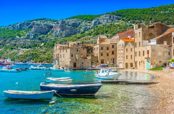 Komiža coastal town with boats on the island of Vis in South Croatia