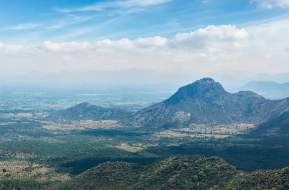 View of Western Ghats mountains under a blue sky and clouds, India