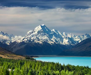 Bright blue water infront of the New Zealand National Park, Mt Cook