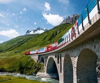 Switzerland railway Glacier Express train travelling through the Alps