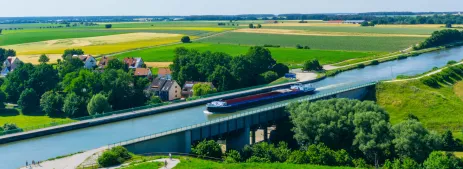 Ship sailing along bridge  on the Rhine–Main–Danube Canal in Bavaria, Germany