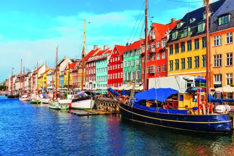 Nyhavn pier with colourful buildings, ships, yachts and other boats in the Old Town of Copenhagen, Denmark.